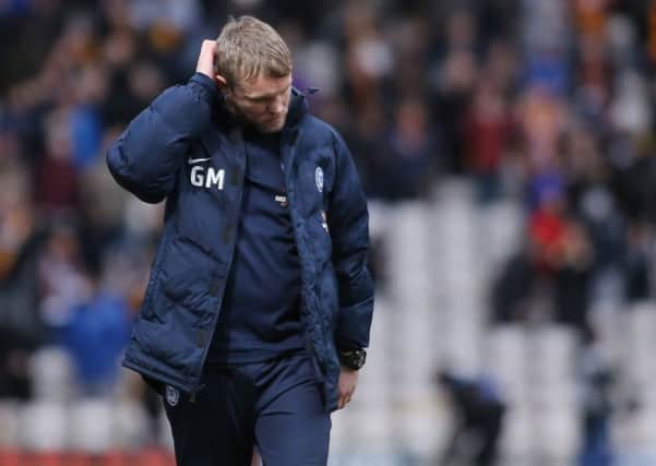 Posh manager Grant McCann has problems to solve