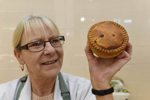 Grassmere pork pie offer from Westgate Arcade butchers. Pictured is Gail Griffiths