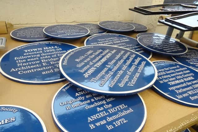 The blue plaques ready for installation