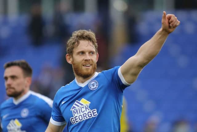Craig Mackail-Smith salutes the Posh fans after his 100th goal for the club. Photo: Joe Dent/theposh.com.