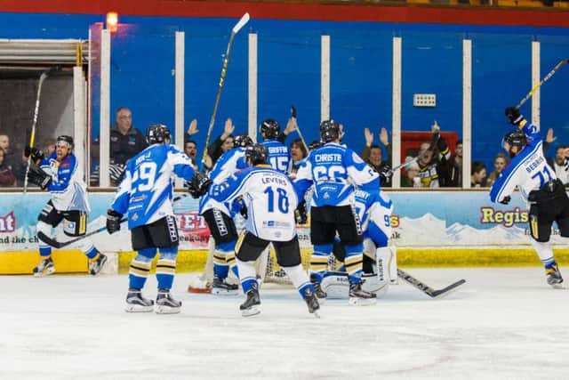 Wahebe Darge (far left) celebrates his match-winning goal for Phantoms against MK. Photo: Tom Scott - AMOimages.com