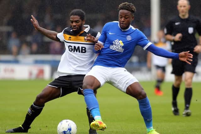Posh midfielder Jermaine Anderson (right) battling with clubmate Anthony Grant in his Port Vale days.