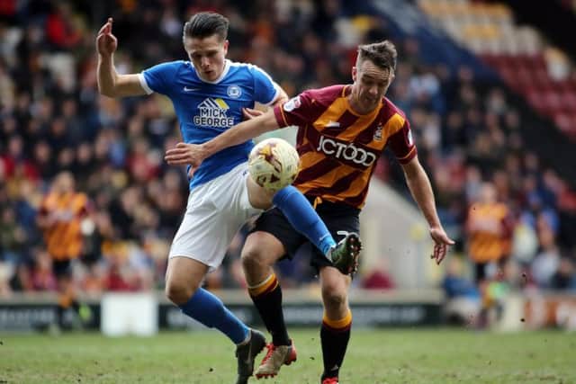 Posh striker Tom Nichols in action.