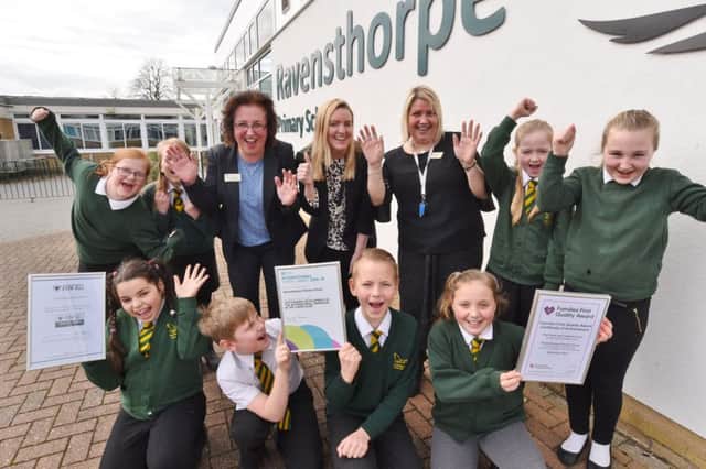 Rachel Wheatley (Dep head), teacher Natalie Fisher and office manager Melanie Barnes with year 6 pupils at Ravensthorpe primary school with their recent school awards. EMN-170803-171503009