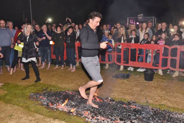 Firewalkers at the Three Horseshoes at Yaxley. Joseph Valente taking part. EMN-171203-123054009