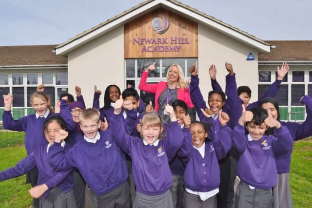 Sonia Kendal, principal of Newark Hill Academy with the head boy and girl with the Academy learning council, celebrating their good OFSTED EMN-170314-165508009