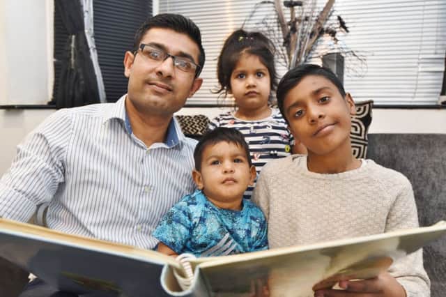 Rahim Ebrahim of Dogsthorpe with his children  Sinan (1), Xyva (3) and Raihan Ebrahim (10) a cystic fibrosis sufferer EMN-170315-084357009