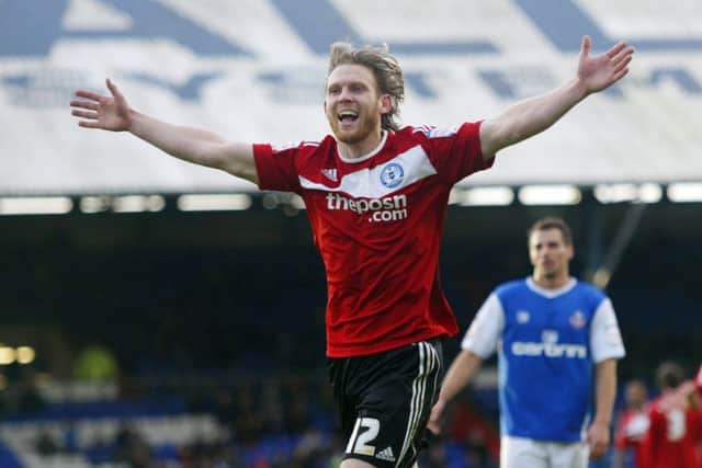 Craig Mackail-Smith celebrates a stunning goal for Posh at Oldham in 2011. Photo: Joe Dent/theposh.com.