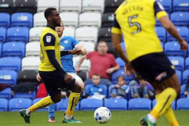 Posh striker Craig Mackail-Smith scores his 100th goal for the club against Oxford.