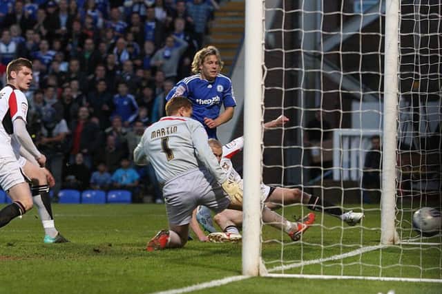 Craig Mackail-Smith scores a crucial play-off semi-final goal for Posh against MK Dons in 2011.