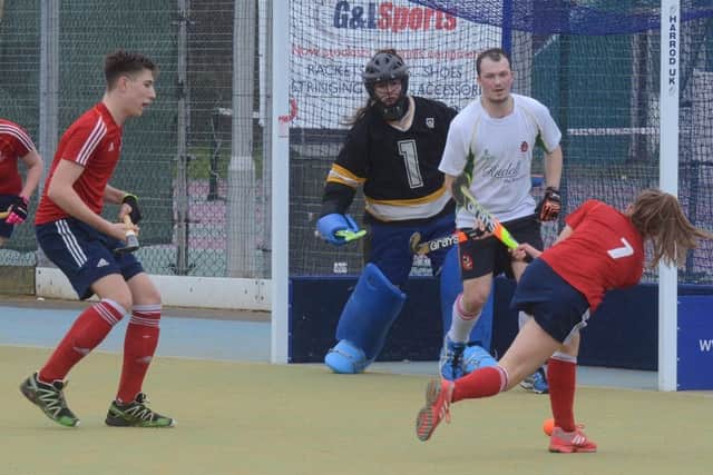 Action from City of Peterborough mixed team's win over Harborne.