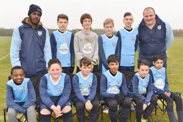 Gunthorpe Harriers Navy Under 12s are pictured before a 6-0 Division Four defeat by Malborne United . From the left are, back, Twon Williamson, Charlie Ayre, Seb Wojcik, Harry Smith, Adam Kirk, Paul Ayre, front, Stefan Kwarawba, Michael Whiting, Brett Allen, Rohan Shah, Adam Berridge and Imaan