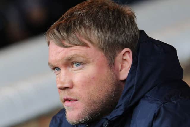 Posh boss Grant McCann watching the Oldham game. Photo: Joe Dent/theposh.com.
