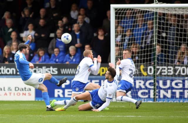 Posh man-of-the-match Michael Smith saw this shot at goal blocked by the Oldham defence. Photo: Joe Dent/theposh.com.