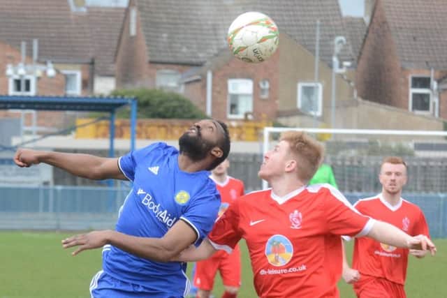 Peterborough Sports' striker Avelino Vieira (blue) on their way to a UCL Premier Division win over Oadby at PSL> Photo: David Lowndes.