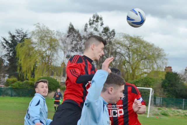 Action from the PFA Minor Cup semi-final between Peterborough NECI (blue) and Cardea. Photo: David Lowndes.