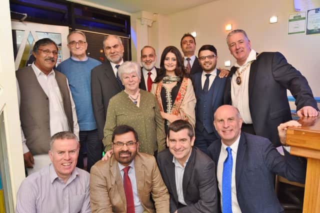 Taj Mahal restaurant, Park Road  -  Ansar Ali and friends organise a meal in aid of the Mayor's Charities. Guests pictured with Mayor David Sanders. EMN-170315-084440009