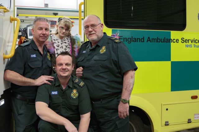 Elisha hills-steedman meets Paramedics that ultimately saved her life after a hit and run. Pictured L2R Simon Bryan,  Elisha, Adrian Hobbs and Adam Hern.
Peterborough Ambulance Station , Peterborough
20/03/2017. 
Picture by Terry Harris / Peterborough Telegraph. THA