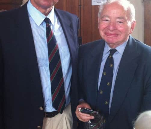 Colin Dexter (right) receiving Honorary Life Membership of the Old Stamfordian Club from club chairman Ian Plant in 2012 ENGEMN00320121207144312