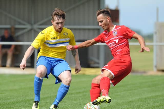 Billy Smith (right) scored for Wisbech at Eynesbury.
