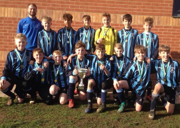 The successful Deeping School Year 8 team are pictured with coach Mr Hipwell. from the left they are, back, Harvey Henderson, Freddie Fraser, Alfie Fox, Max Rigby, Beck McCarthy, Finley Nottingham, front, Finlay Henderson, Harrison Pearce, Harry Barsby, Jamie Allen, Adam Blackbird, Larson Cook, Archie Rickards and Oliver Tooth.