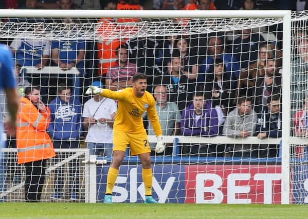 Posh goalkeeper Dion-Curtis Henry in action on his sole club appearance.