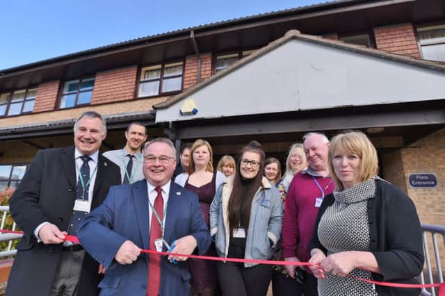 Councillors Graham Casey and Wayne Fitzgerald at the re-opening of Herlington House with staff and guests. EMN-170322-084025009