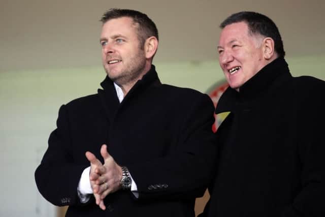 Posh chairman Darragh MacAnthony (left) is seeking an experienced assistamt manager to help Grant McCann.