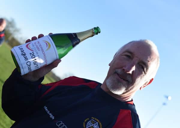 It was a champagne moment for Borough head coach Lee Adamson at Fengate today.  Picture: Kevin Goodacre