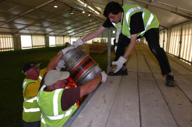 CAMRA members Ray Kennedy, John Temple, Bernie Grange and (right), Marcus Sims, load up the stillages on the embankment for the 33rd Peterborough beer festival