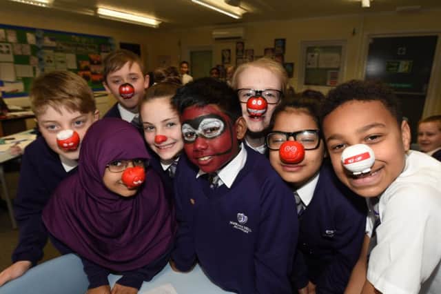 Red Nose Day 2107. Pupils at Newark Hill Academy with their noses. EMN-170324-174633009