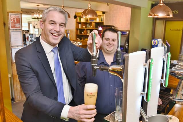 Official opening of the Railway pub at Station Road, Whittlesey. Stephen Barclay MP is with  licencee  Simon Bains. EMN-170326-232201009
