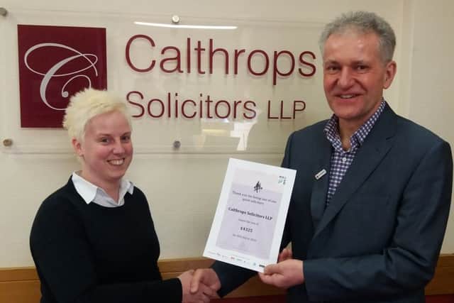Laura Brown of Calthrops Solicitors with John Colhurst from the Red Cross
