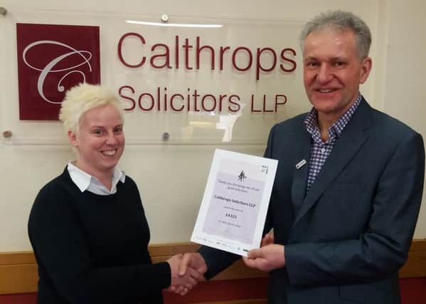 Laura Brown of Calthrops Solicitors with John Colhurst from the Red Cross