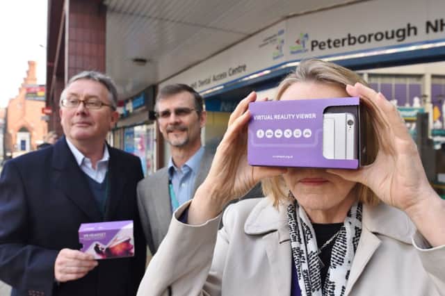 Coun Peter Hiller, John Worsfold, an RNIB inventor and Coun Irene Walsh using a virtual reality viewer to see the world through the eyes of someone with eye problems EMN-170328-173641009