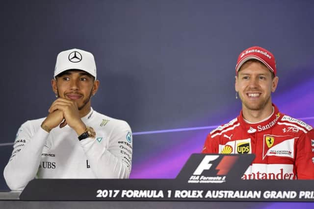 Sebastian Vettel (right) and Lewis Hamilton after the Australian Grand Prix.