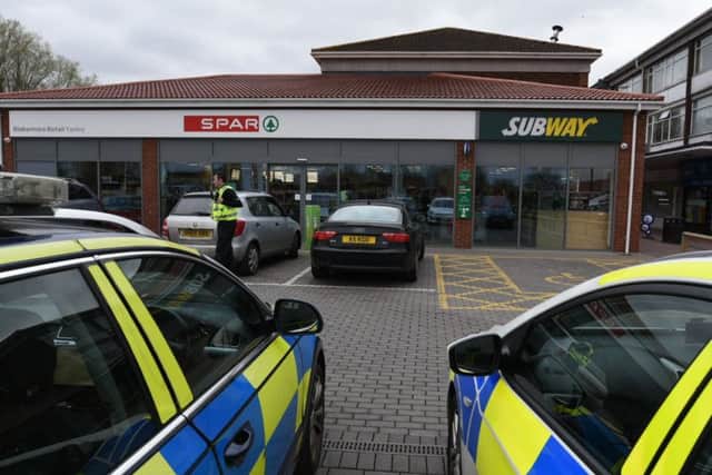 Police outside Spar in Yaxley this afternoon - Photo: David Lowndes