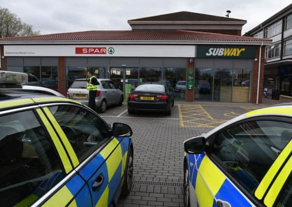 Police outside Spar in Yaxley this afternoon - Photo: David Lowndes
