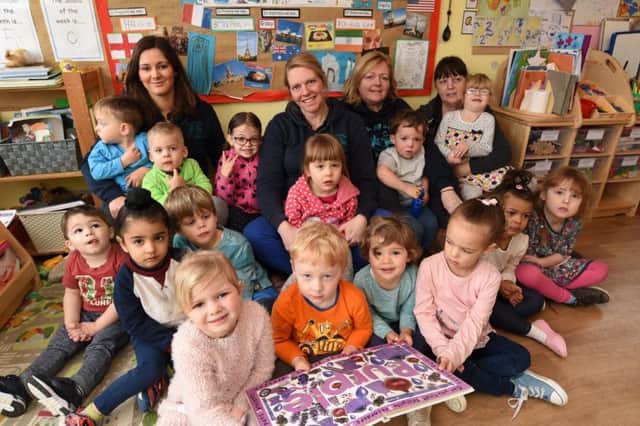 Staff and children at the Steppings Stones day nursery at Oakdale Avenue, Stanground which has just  gained a Good OFSTED rating EMN-170328-173423009