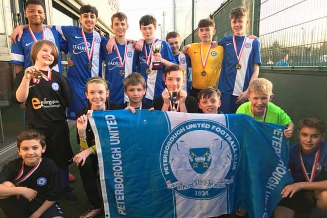 Pictured are the two  successful Peterborough United deaf football teams. From the left they are,  back, Vitor Balde, Husnayn Hussain, William Palmer, Harry Howarth, Jo Clarke, Jude Meloni,  Aaron Osker, front, Simao Martins, Holly Stallan, Ava Osker, Neo Knight, Harry Jacobs, Findlay McEwan, Daniel Monaf and Ed Phillips.