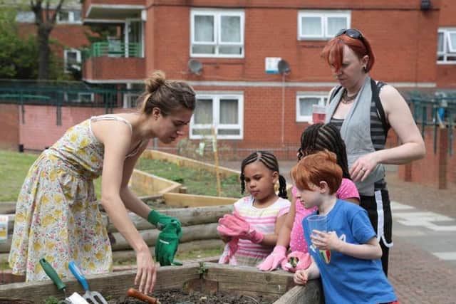 Children dig deep to help the gardens grow at Bretton. TOvrwH5oCwmoa_m_0f4c