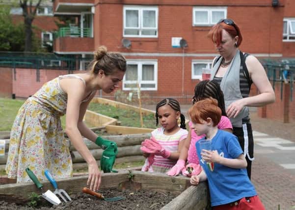 Children dig deep to help the gardens grow at Bretton. TOvrwH5oCwmoa_m_0f4c