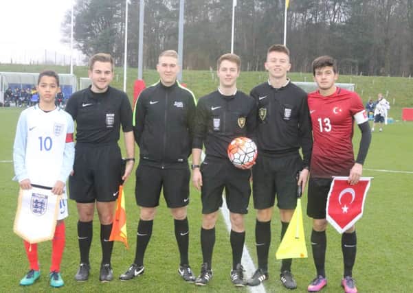 These young referees were on international duty recently. They qualified as officials by passing a local course.