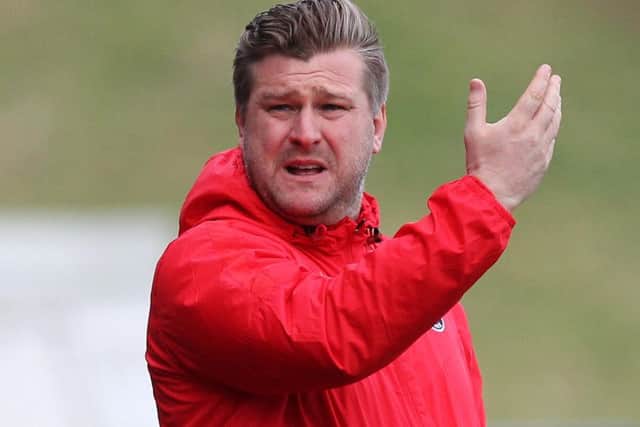 Charlton manager Karl Robinson has a big fan in Posh boss Grant McCann.