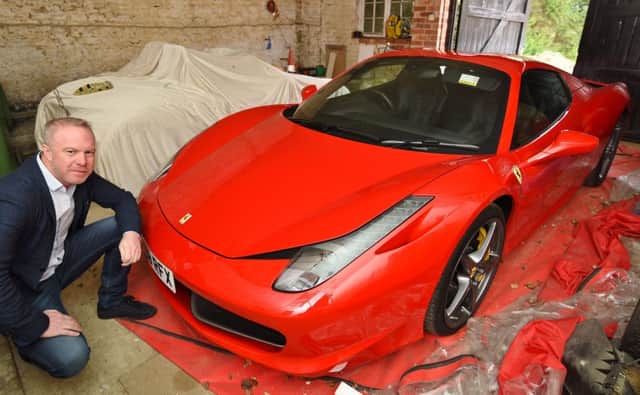 Scott Nicholas  with his Ferrari Spider which was damaged by a pothole near Ufford. EMN-170322-145159009