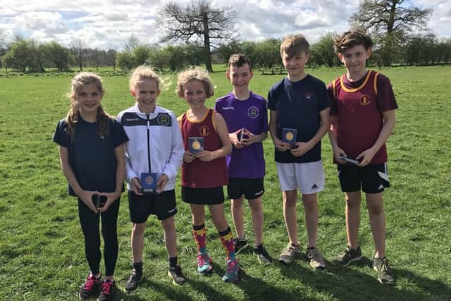 The first three home in the boys and girls races at the Peterblorough Primary Schools Cross-Country Championships.