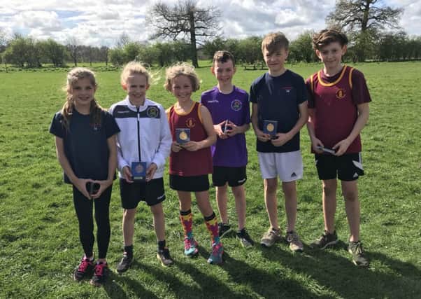 The first three home in the boys and girls races at the Peterblorough Primary Schools Cross-Country Championships.