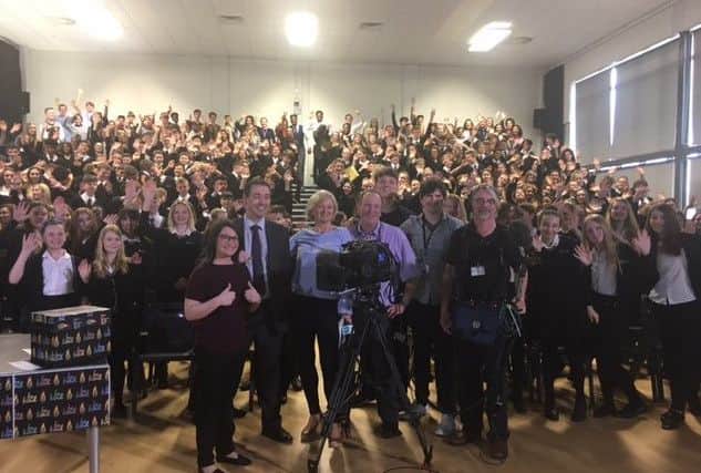 The film crew, pupils and staff in the school hall