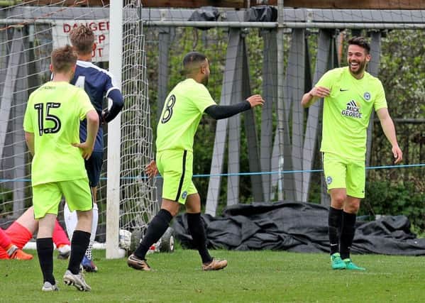 Brad Inman (right) is congratulated by Adil Nabi after scoring at Southend. Photo: Nicky Hayes Photography.