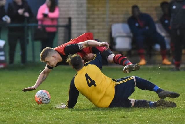 Harry Woodward of Bretton North End was lucky not to pick up a caution for this early challenge. Photo: David Lowndes.